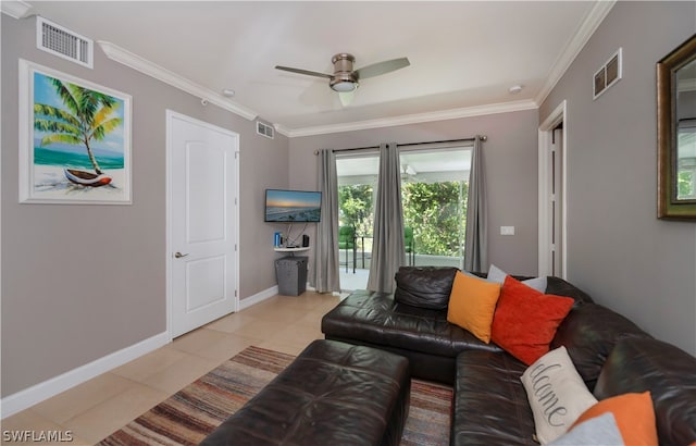 living room featuring tile floors, ceiling fan, and ornamental molding