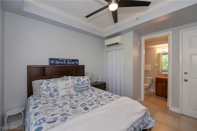 tiled bedroom with an AC wall unit, ceiling fan, connected bathroom, and ornamental molding