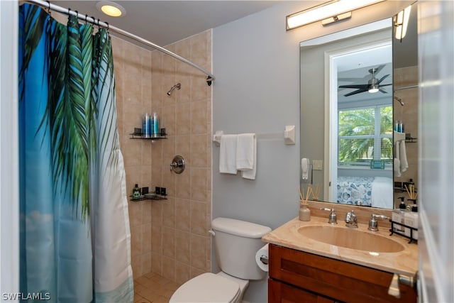 bathroom with toilet, vanity, ceiling fan, and a shower with shower curtain