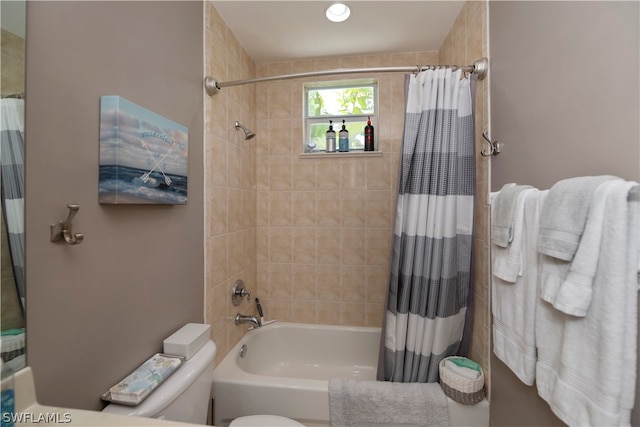 bathroom featuring toilet and shower / tub combo