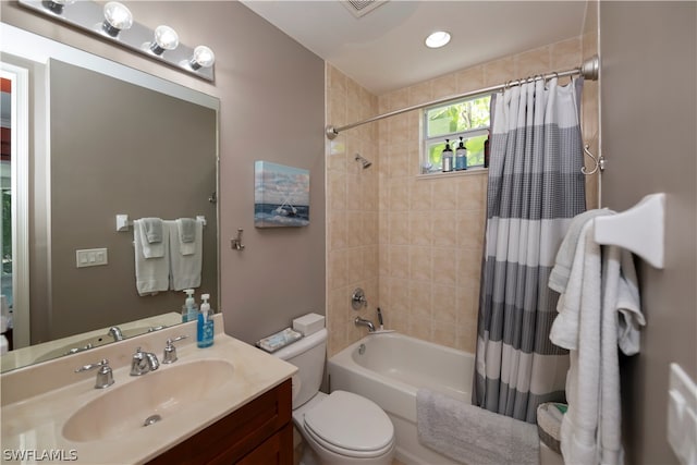 full bathroom with shower / bath combo, vanity, and toilet