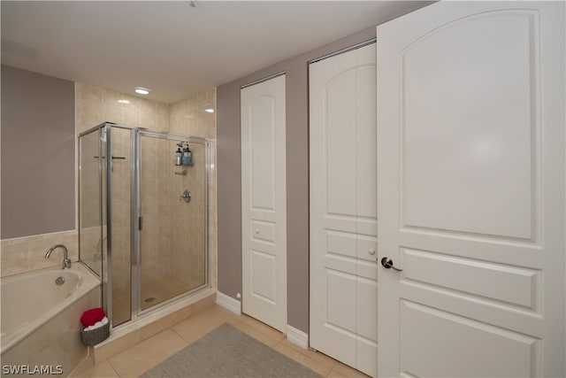 bathroom with tile floors and separate shower and tub