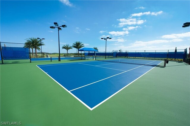 view of sport court with basketball hoop