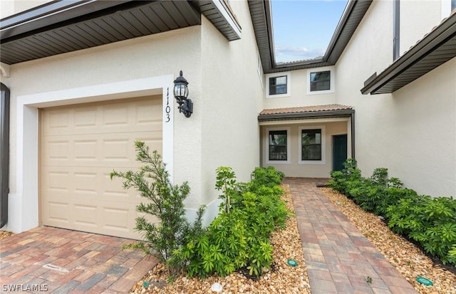 property entrance featuring a garage