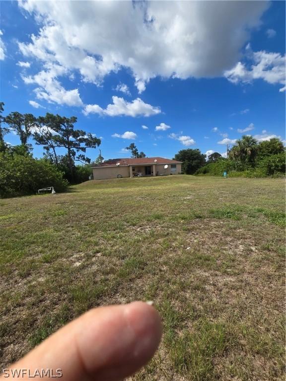 466 Redwing St, Lehigh Acres, FL 33974 - view of green lawn