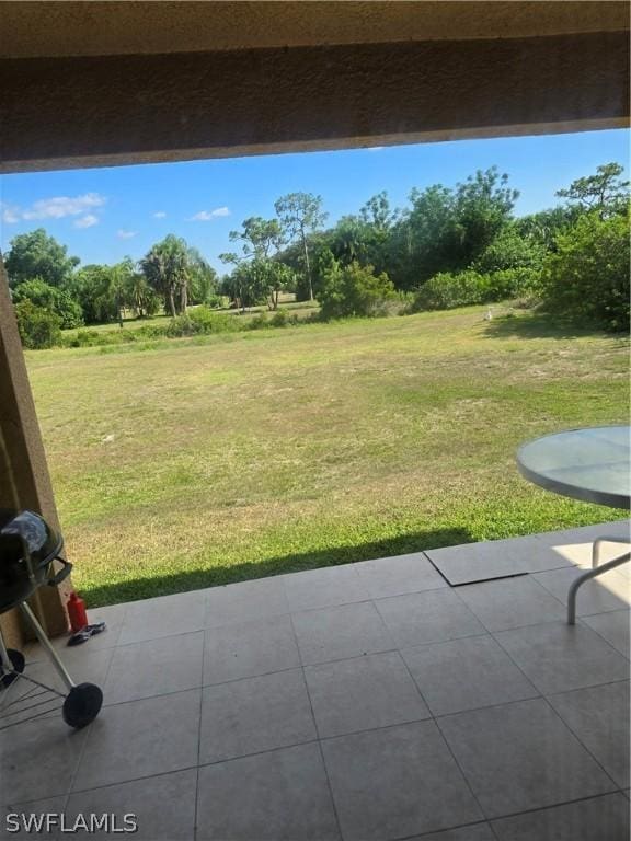 466 Redwing St, Lehigh Acres, FL 33974 - view of green lawn with a patio area