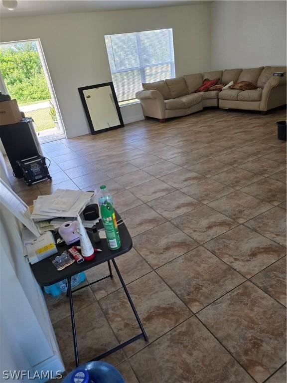 unfurnished living room featuring tile patterned floors