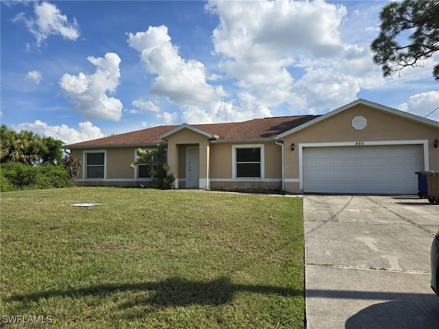 ranch-style house with a garage and a front lawn