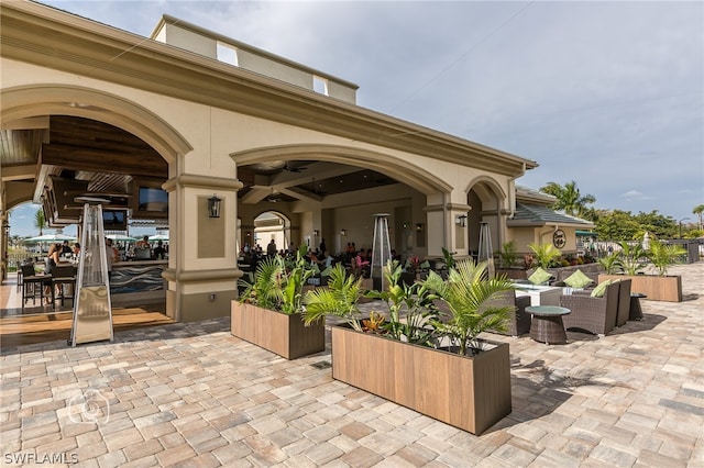 view of patio / terrace with ceiling fan and an outdoor hangout area