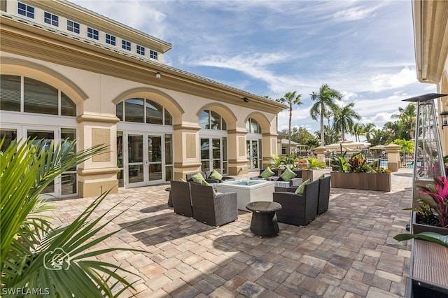 view of terrace with outdoor lounge area and french doors