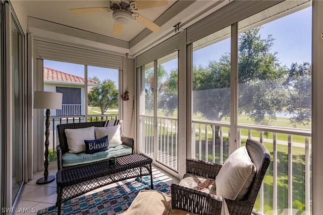 sunroom featuring ceiling fan