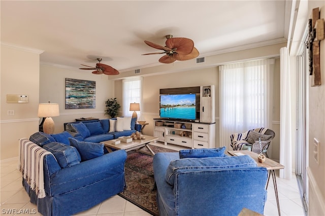 living room featuring ceiling fan, ornamental molding, and light tile floors