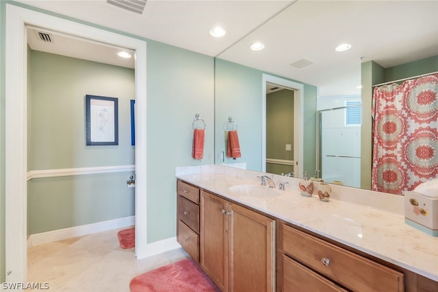 bathroom with vanity and walk in shower