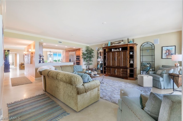 living room featuring crown molding and a chandelier