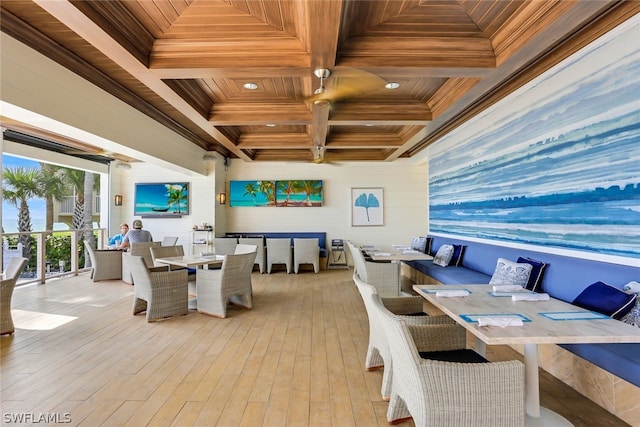 dining room with coffered ceiling, wooden ceiling, crown molding, and beamed ceiling