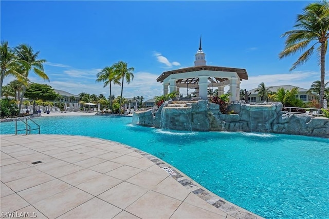 view of pool featuring a gazebo and pool water feature