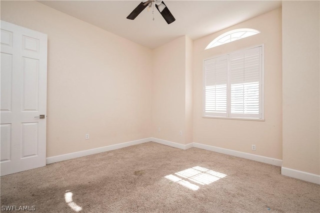 carpeted empty room featuring ceiling fan and a healthy amount of sunlight