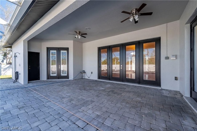 view of patio / terrace featuring ceiling fan and french doors