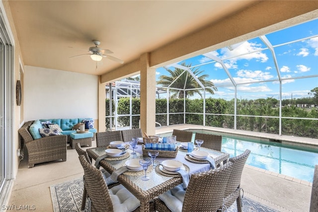 exterior space with ceiling fan, an outdoor hangout area, and glass enclosure