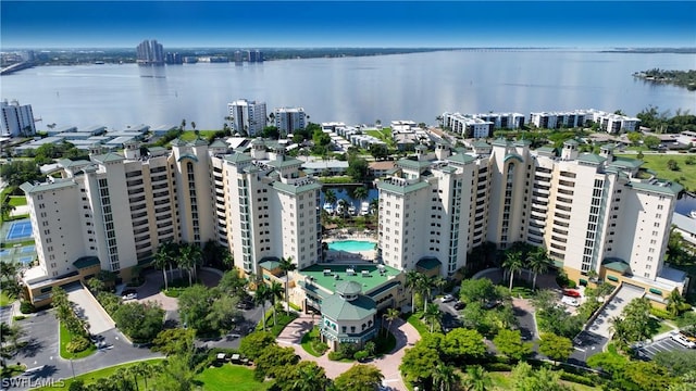 birds eye view of property with a city view and a water view