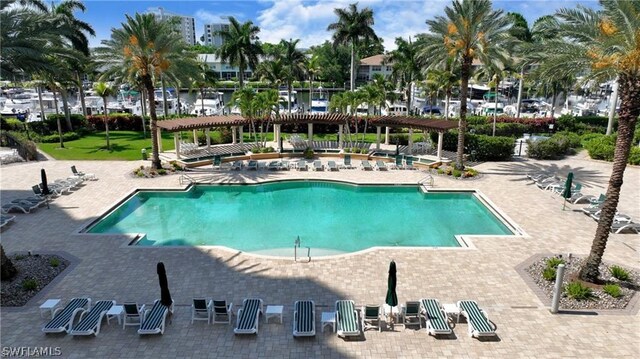 view of pool featuring a pergola and a patio