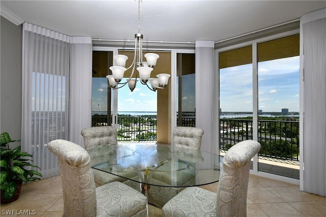 dining room featuring a chandelier and tile patterned flooring