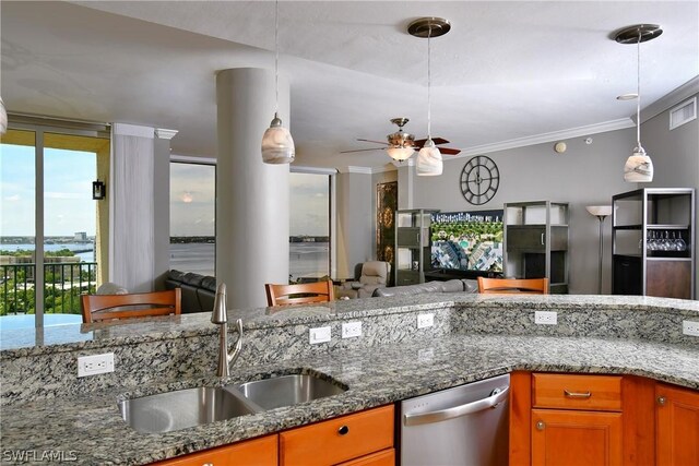 kitchen with hanging light fixtures, stainless steel dishwasher, ceiling fan, and sink