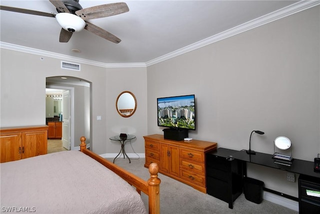 bedroom featuring visible vents, light carpet, arched walkways, crown molding, and baseboards