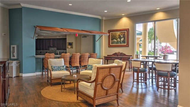 dining area with dark hardwood / wood-style floors and ornamental molding