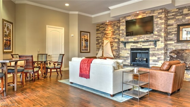 living room featuring recessed lighting, wood finished floors, a fireplace, and ornamental molding