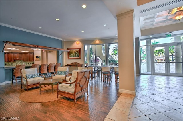 living room featuring recessed lighting, light wood-style floors, crown molding, and coffered ceiling