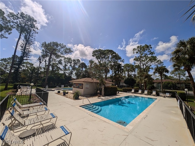 view of swimming pool featuring a patio