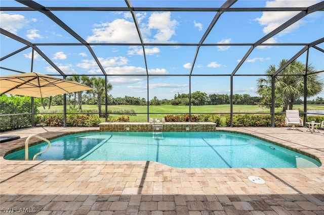 view of swimming pool with glass enclosure and a patio