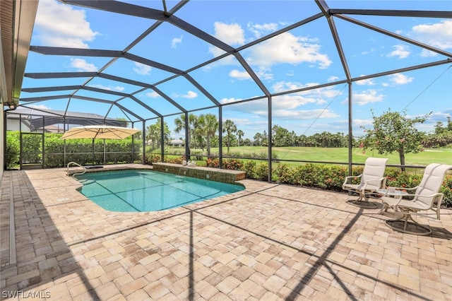 view of swimming pool featuring a lanai and a patio