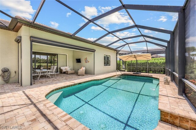 view of swimming pool featuring an outdoor living space, a patio, and glass enclosure