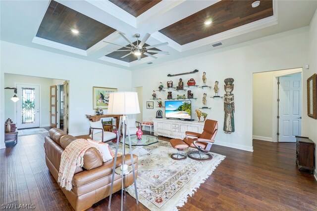 living room with dark hardwood / wood-style flooring, coffered ceiling, ceiling fan, crown molding, and beamed ceiling