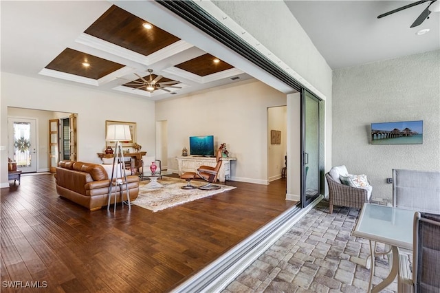 living room with beam ceiling, ceiling fan, dark hardwood / wood-style floors, and coffered ceiling