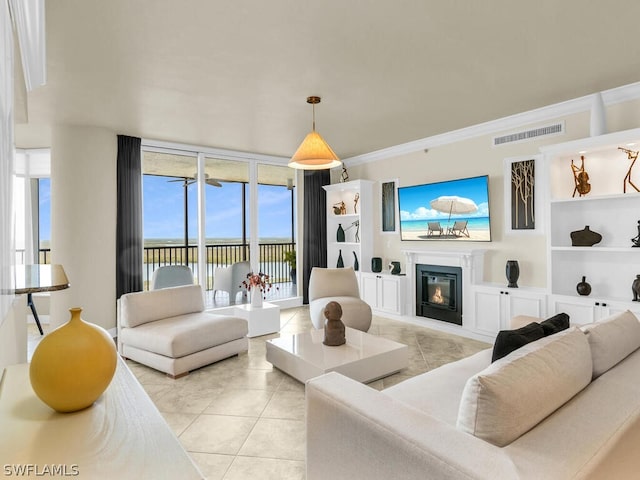 tiled living room with built in shelves and ornamental molding