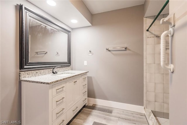 bathroom featuring vanity and hardwood / wood-style flooring