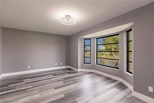 spare room with light hardwood / wood-style flooring