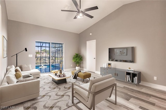 living room with high vaulted ceiling, ceiling fan, and light hardwood / wood-style flooring