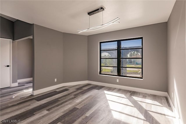 unfurnished dining area featuring hardwood / wood-style floors