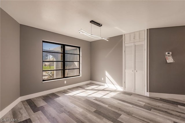 unfurnished dining area featuring light hardwood / wood-style floors