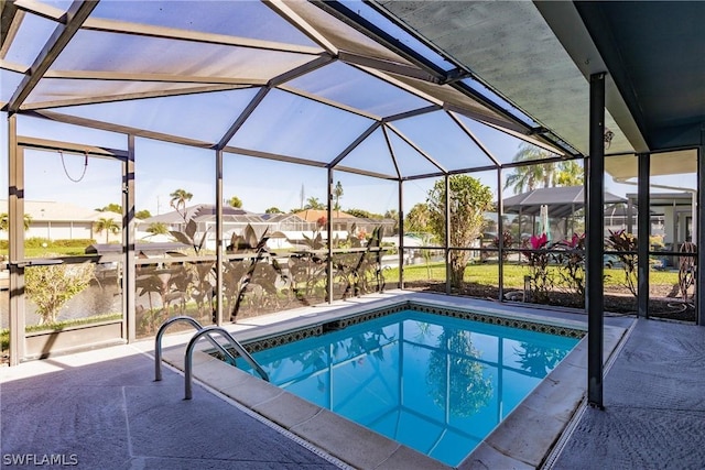 view of pool featuring a lanai and a patio