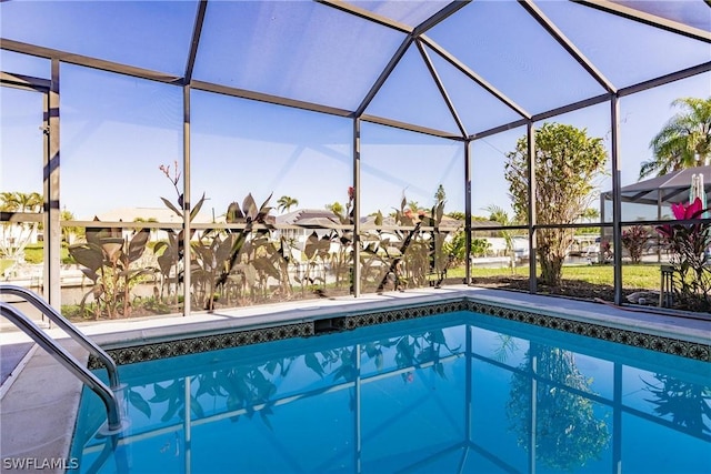 view of pool with a lanai