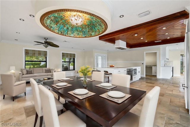 dining space featuring wooden ceiling, ceiling fan, and ornamental molding