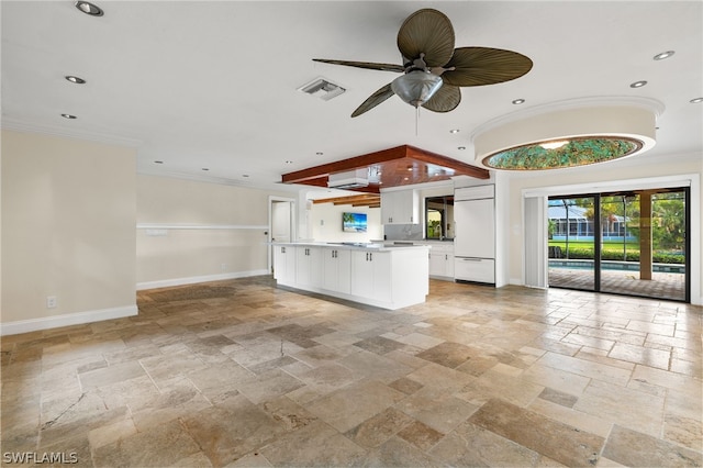 kitchen featuring ceiling fan, crown molding, and white cabinets