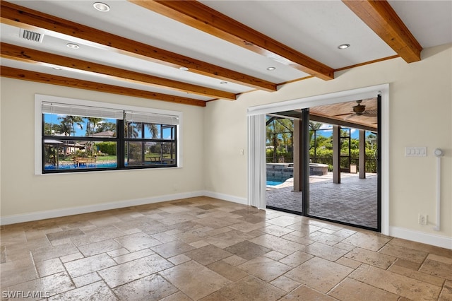 spare room featuring ceiling fan and beamed ceiling