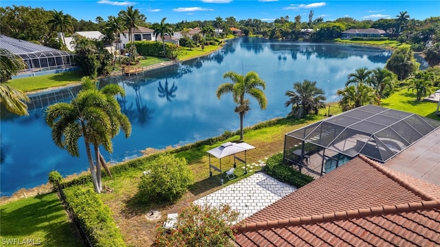 birds eye view of property with a water view