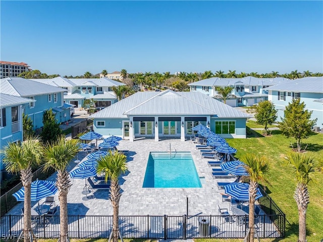 view of pool featuring a yard and a patio